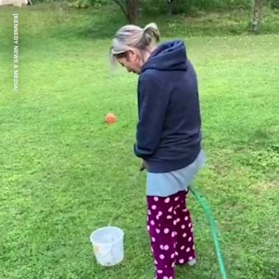 Man sick of wife complaining about poor toilet aim challenges her to try with bucket and hose