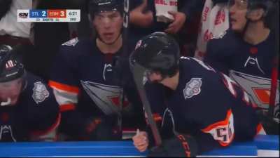 Jordan Binnington slowly lays on top of Connor McDavid.