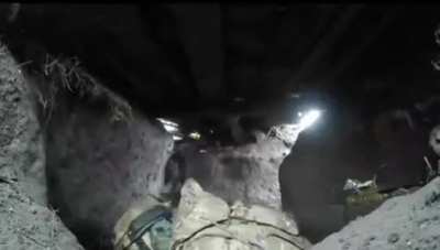Ukrainian soldier guards his position with intense artillery sound around. Archival footage of the battle for Avdiivka