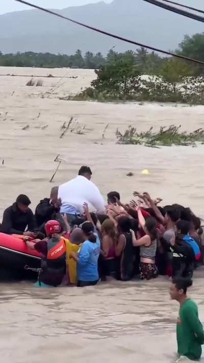 Self-serving and narcissistic politician waving and giving "bread crumb donations" to victims of a recent typhoon.