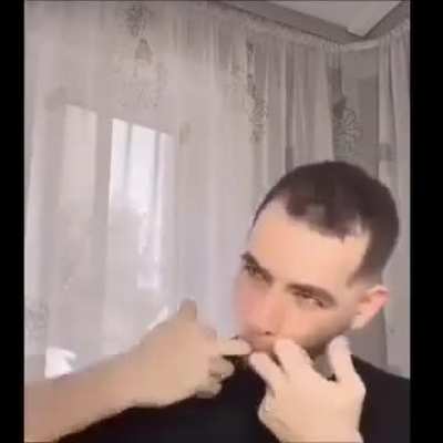 Putting a lightbulb in your mouth.