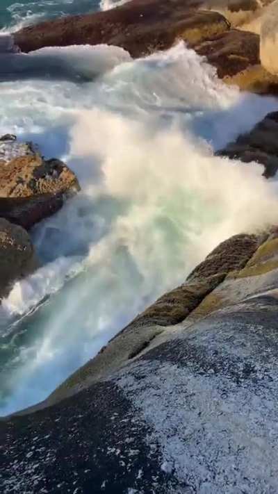 Jumping off a rock into the cold ocean and swimming against big tides, waves, aerated water and whirlpools...