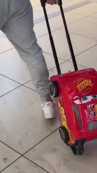 Legend with his lighting McQueen suitcase 😂😂