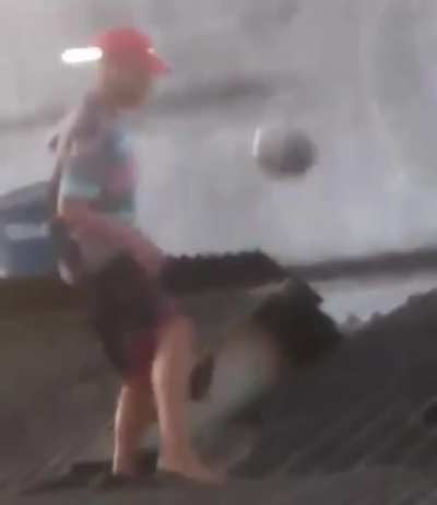 boy balancing ball on the roof...