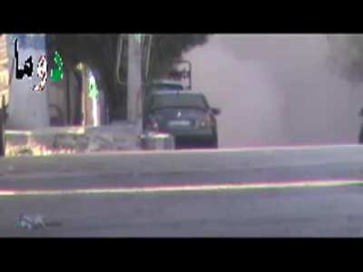 Syrian rebel runs out in front of tank, shoots and destroys it. "Rocket Hits Syrian Tank at Close Range"