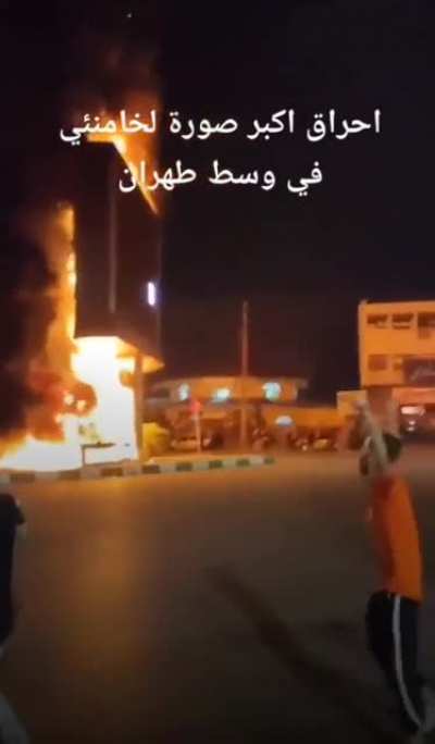 The largest picture of Ali Khamenei (supreme leader of Iran) was burned in the center of Tehran