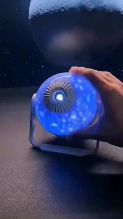 This miniature 'Galaxy Projector' casts large-scale images of galaxies onto your walls & ceilings.