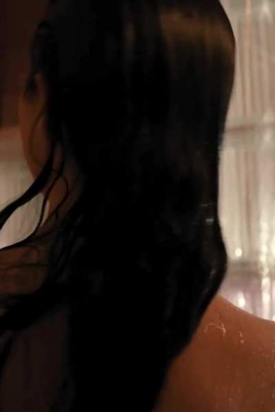 Selena Gomez - showering topless (nipples hidden) in new show