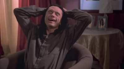 In The Room (2003), Johnny laughts all the time, meaning that he suffers from the same condition as Arthur Fleck from The Joker (2019). This foreshadows that Johnny ends up becoming The Joker
