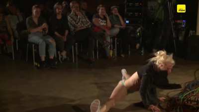 Lady's breasts exposed during handstand and cartwheels