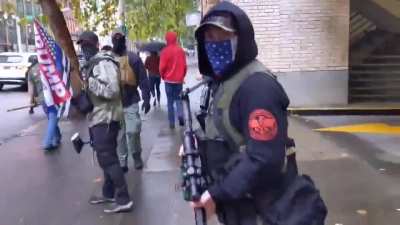 Woman filming gets threatened by some lovely Trump supporters carrying assault rifles on the sidewalk