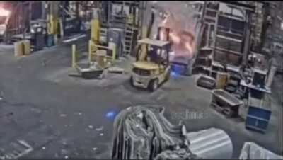 Worker dumps load on molten metal way too fast