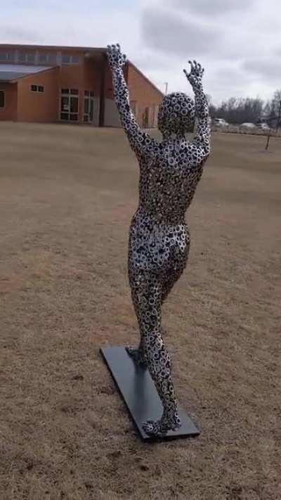 Figure Sculpture Made From Polished Stainless Steel Hex Nuts