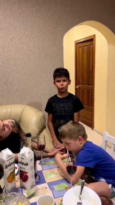 Kid hits vape while his brother thanks their mom for raising him well