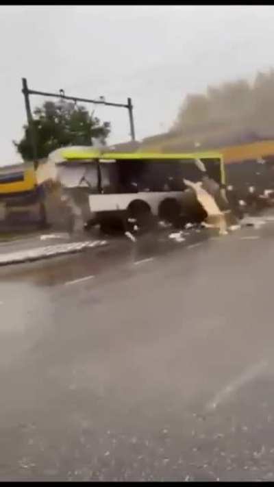 Dutch bus ripped in half by train