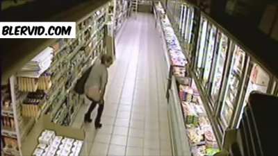 Woman in a supermarket. Guess what she does....