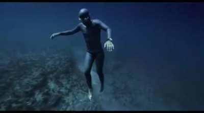 Diver gets caught in an undersea current.