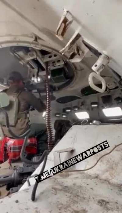 An inside view of a Ukrainian soldier operating a BTR-80 firing at Russian targets in eastern Ukraine.