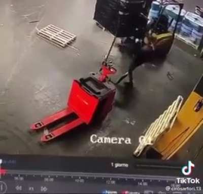 OSHA Approved method of removing an errant piece of wood from a pallet.