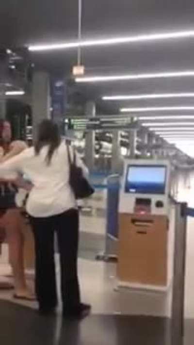 Woman freaks out after airport employee stops helping her when she starts filming