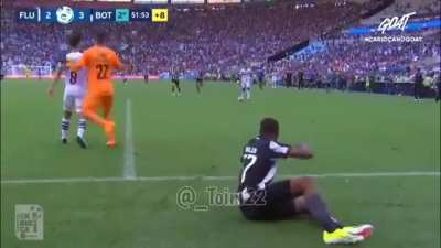 Hilarious scene in Brazil: The Botafogo player drags his &ldquo;injured&rdquo; teammate back into the field to try to waste time, then the Fluminense players drag him back out so the game can go on. 