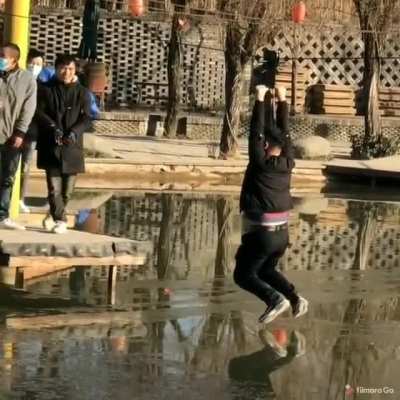 Helping a guy who's about to fall into freezing water