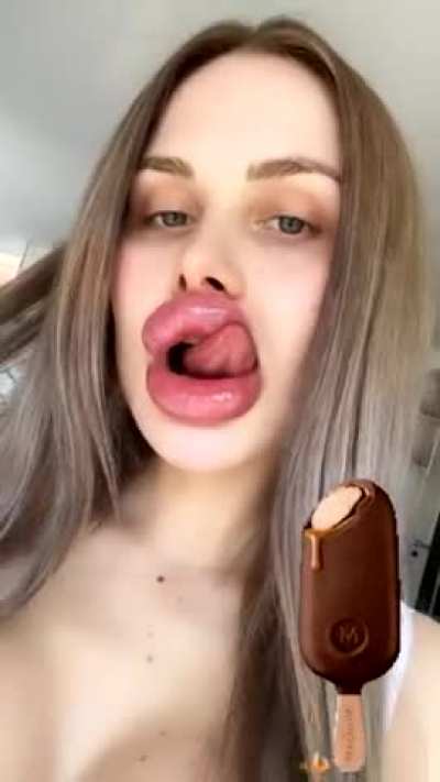 Licking her enormous pecker pillows