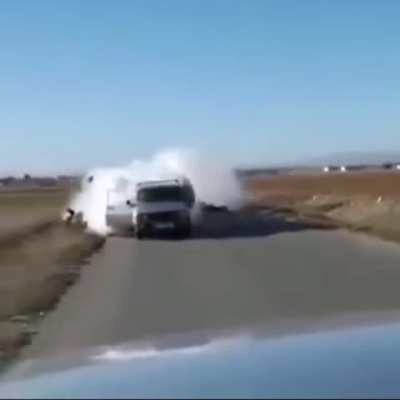 A guy tries to shoots an &ldquo;RPG&rdquo; in the back of a car, but it back fires... ( it doesn&rsquo;t look like an rpg but idk)
