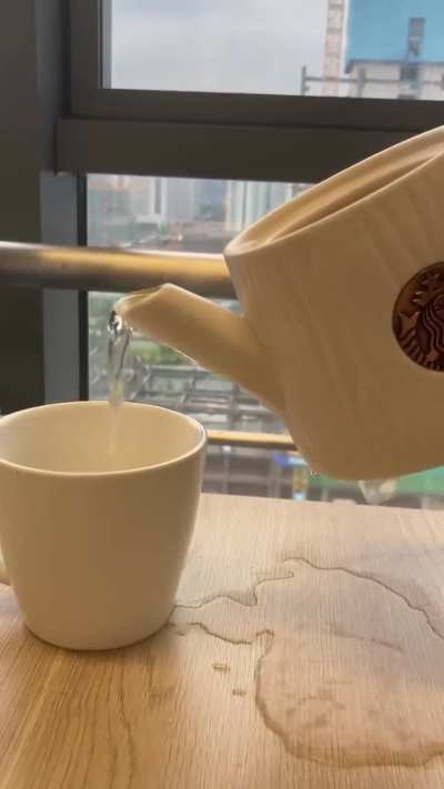 Starbucks teapot spills everywhere.