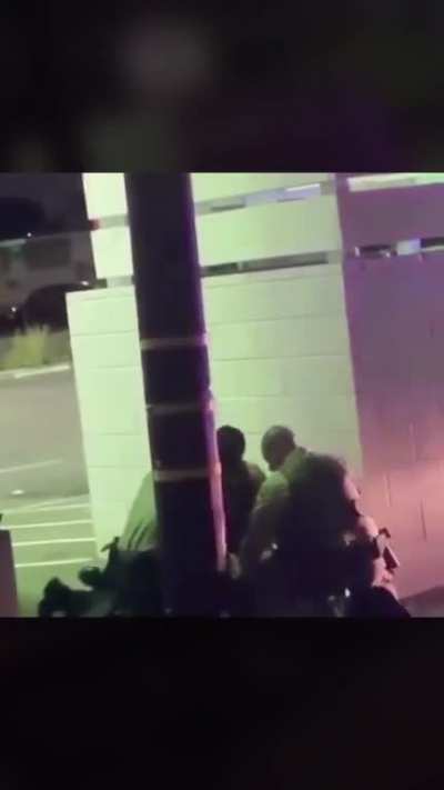 Cops take a civilian behind a wall to beat him. Apparently, he wasn&rsquo;t even apart of a protest and was trying to get home