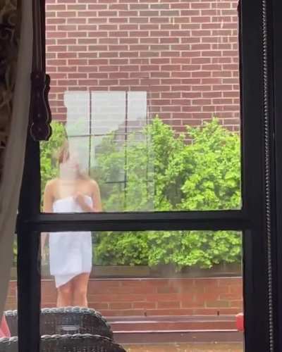 Katherine Langford dancing in a towel