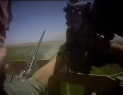(Visible enemy) American turret gunner’s .50 caliber stops working as they are being ambushed by Taliban so he switches to an M4 and a 249 LMG. Afghanistan, date unknown.