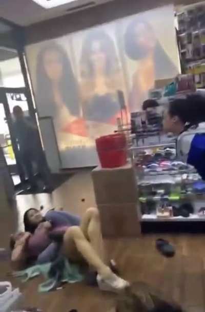 Trashy woman caught stealing in hair store.