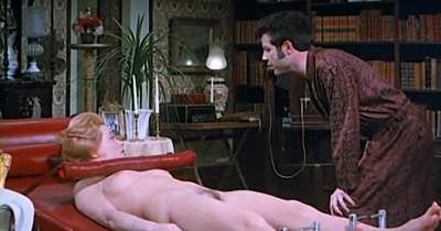 Sue Longhurst restrained on trick couch - "What the Swedish Butler Saw" (1975)