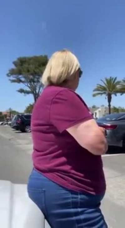 Woman purposely sits on teens car to reserve a parking spot!