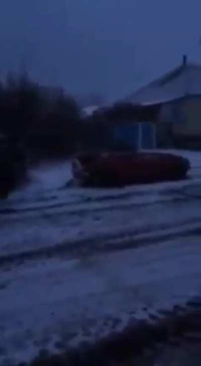 Russian occupiers running over empty civilian vehicle for fun