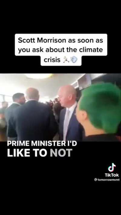 Scott Morrison walks away from a young person after they ask him climate crisis while someone films