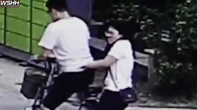 Guy Spartakicks a kid because his girlfriend got hit by a soccer ball