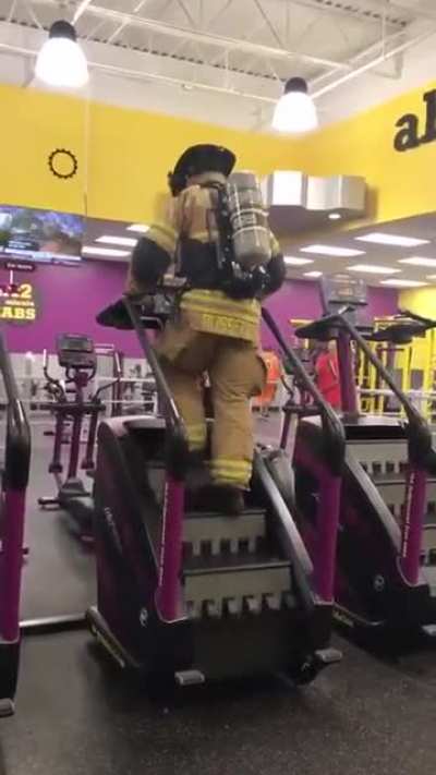Fully dressed with all his equipment, this firefighter climbed 110 stories in remembrance of 9-11.