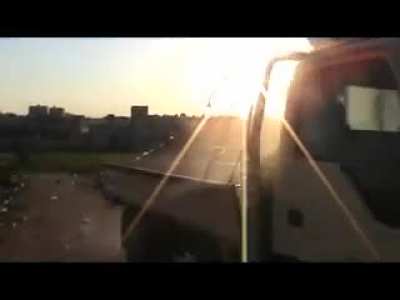 Early war clip from Syria, March 23 2012. Brief clip of a rebel fighter in Azaz (Northern Aleppo countryside) firing some sort of improvised launcher at an army position.