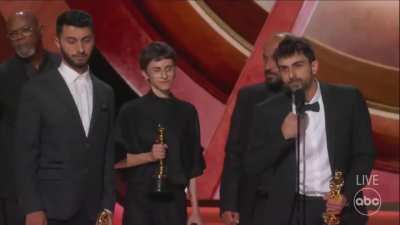 Israeli-Palestinian Film &lsquo;No Other Land&rsquo; Wins Best Documentary Feature. Palestinian activist Basel and Israeli journalist Yuval openly address Israeli occupation on stage, emphasizing that US foreign policy actively obstructs a path to peace.