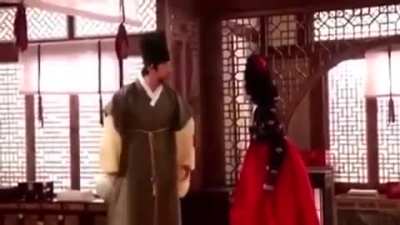 Man bounces his big ball on someone's face.