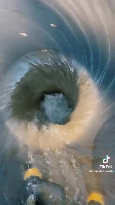 Removing a manhole cover to let it drain