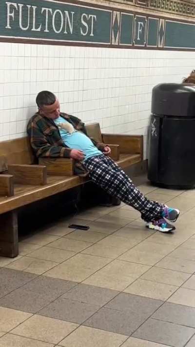 Taking a little nap in a New York subway station