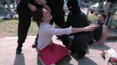 Vegans demonstrating how it feels like to take milk from animals