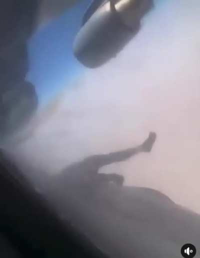 A dead body hanging from the airplane posted earlier