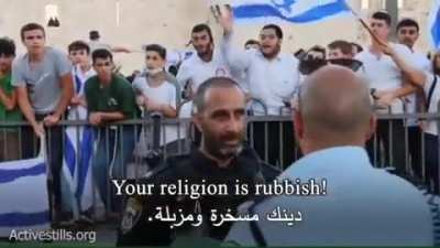 Israeli settlers openly raising racist slogans towards Palestinians and calling for an apartheid.
