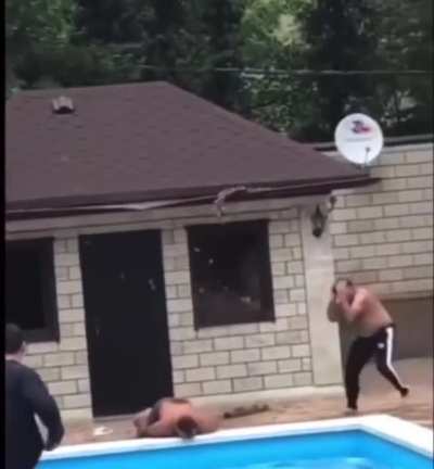 Guy jumping off roof to pool doesn&rsquo;t jump far enough and lands on his face.