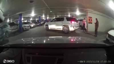 Main character standing in a parking spot, waiting for her friend and refusing to leave . (Recorded this today in San Jose. Parking was impossible to find near the mall because it&rsquo;s Black Friday. The lady from the car before me got out and tried to argue.