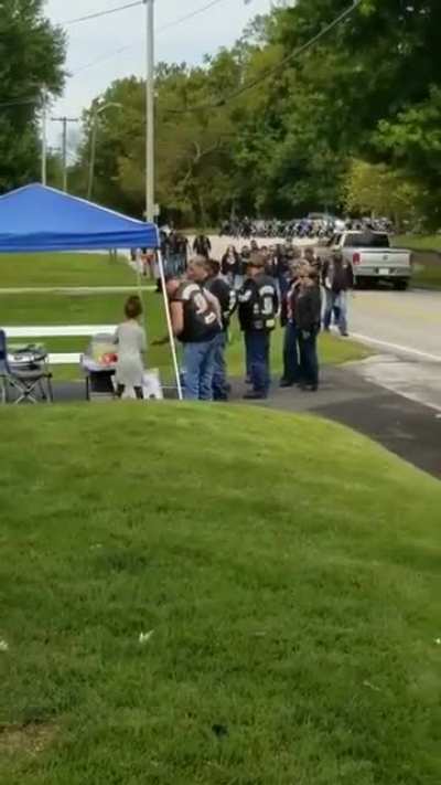 Motorcyclists stop by girls lemonade stand to make her day.
